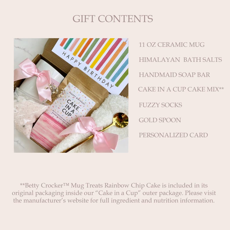 May include: A birthday gift box with a mug, bath salts, soap, cake mix, fuzzy socks, a gold spoon, and a personalized card. The box features a card with a colourful striped design and the words "Happy Birthday". The mug is 325 ml.