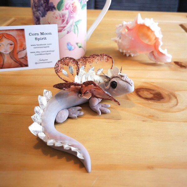 One of a kind, hand-crafted spirit figurine of a leaf dragon called "Clockwork" blessed with red rose oil