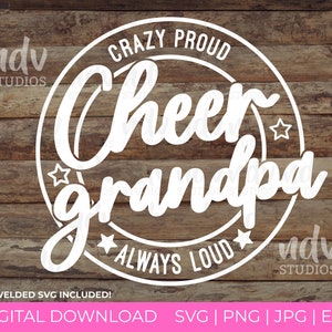 May include: White graphic design on a wooden background. The design reads "CRAZY PROUD Cheer grandpa ALWAYS LOUD" in a circular layout with stars. The text "ndv STUDIOS" appears on the top left and bottom right.