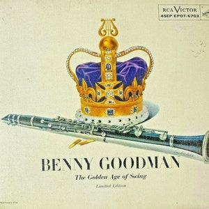 May include: A vintage vinyl record album cover featuring a gold crown with purple velvet lining and a clarinet resting on top. The album is titled "Benny Goodman - The Golden Age of Swing - Limited Edition" and features the RCA Victor logo.