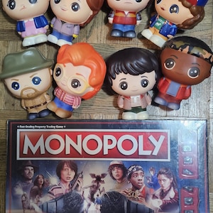 Stranger Things™ Collectibles Lot: Monopoly Board Game & 8 Soft’n Slo Squishies