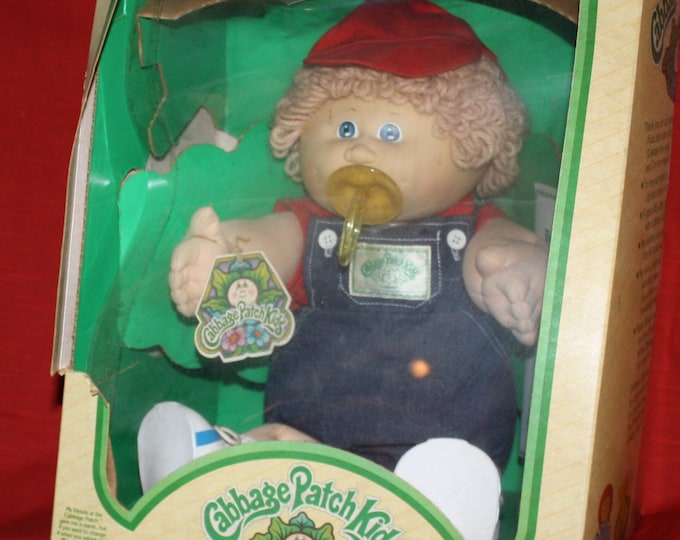 Featured listing image: 1983 Cabbage Patch Kids "Norton Augustine" Coleco CPK Xavier Roberts Boy Doll in Original Box with Tag & Adoption Paper NRFB