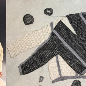 May include: Cream-colored, open-front cardigan with gray trim, displayed on a person and flat lay. The cardigan features a textured knit design. Additional cardigans in gray and cream are shown with yarn balls.