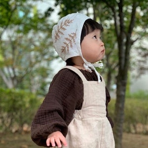 Soft and Breathable Linen Baby Bonnet with Hand Embroidered Pattern