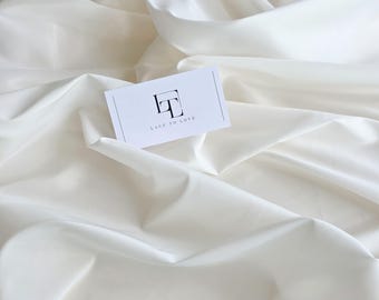 Tejido elástico de forro color marfil cortado a medida, tejido elástico para boda color marfil claro, tejido de forro para falda y vestido blanco, MT6002