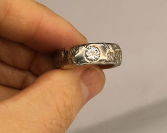 The 'Nomad' 7.5US silver sandcast rustic moissanite ring band