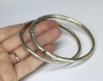 Sandcast bangle textured with gemstones