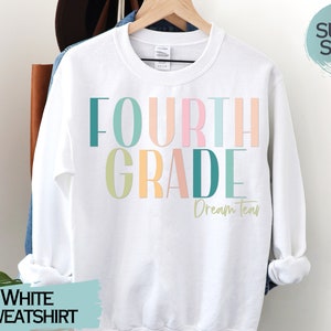 May include: White sweatshirt with the text "FOURTH GRADE Dream Team" in colorful letters.