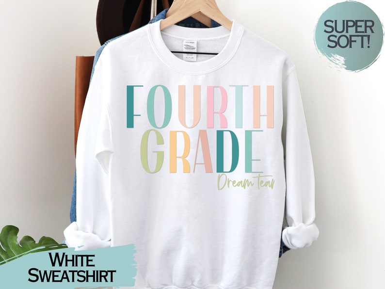 May include: White sweatshirt with the text "FOURTH GRADE Dream Team" in colorful letters.