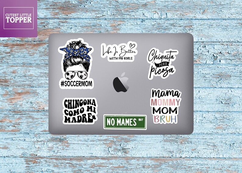 May include: A set of six colorful vinyl stickers with various phrases and designs. The stickers feature phrases like "#soccermom", "Chingona como mi madre", "Life is better with my girls", "Chiquita pero picosa", "No mames", and "Mama Mommy Mom Bruh".