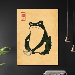 Puede incluir: Una ilustración de estilo vintage de una rana verde sosteniendo un cuenco, con el carácter japonés "関" en rojo sobre la rana.