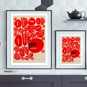 May include: Two framed prints with a red and white abstract design. The larger print has the text "A New Revolution" and "Revo" in black. The smaller print has the text "Revo" in black.