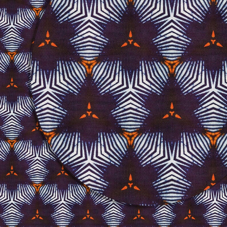May include: A purple fabric with a white and orange geometric pattern. The pattern is made up of repeating stars with white stripes and orange accents.