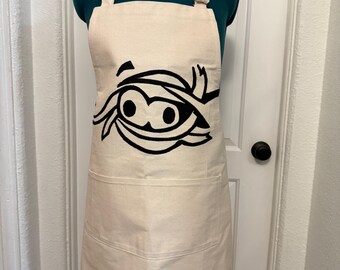 Avental de cozinha de múmia de Halloween com bolsos, inspirado na múmia do McDonald's.