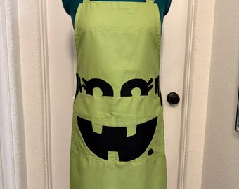 Avental de cozinha de Halloween com bolsos, inspirado na bruxa do McDonald's.