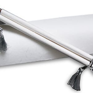 May include: A white scroll with silver tassels and a silver cap, rolled up and placed in a white pillow box.
