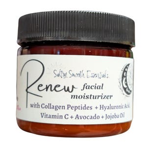 May include: A brown glass jar with a black lid, labeled "Renew facial moisturizer" with the text "Sultry Smooth Essentials" and ingredients listed as "Collagen Peptides + Hyaluronic Acid, Vitamin C + Avocado + Jojoba Oil".