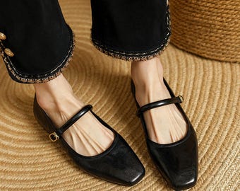 Mary Janes clásicas de cuero negro, zapatos vintage hechos a mano, Mary Janes para el día a día, Mary Janes negras retro, zapatos elegantes con correas de seguridad.