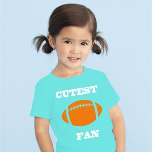 Cutest Fan toddler t-shirt, aqua and orange, makes a perfect gift! Customize with a name & number!
