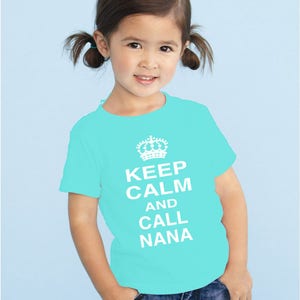 May include: A turquoise t-shirt with a white crown and the text "Keep Calm and Call Nana".