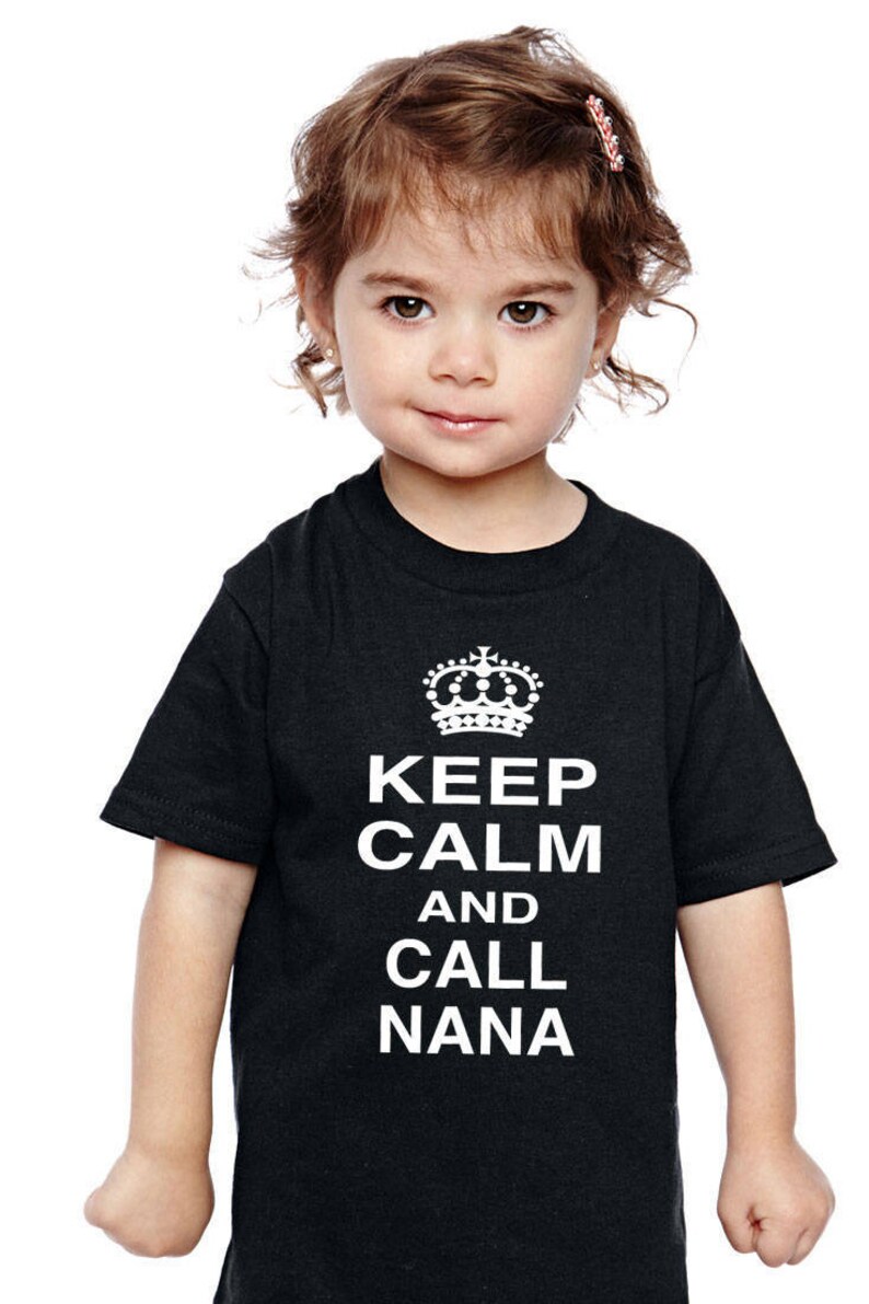 May include: A black t-shirt with a white crown and the text "Keep Calm and Call Nana" printed on the front.