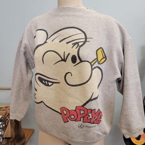 Sudadera clásica de cuello redondo de Popeye de los años 90 / Paris Sport Club vintage, talla grande, mediana, personaje de dibujos animados, película Olive Oyl, Robin Williams, cara grande, AOP