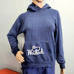 May include: A set of three ceramic mugs with a speckled, matte finish. Each mug features a different color: light blue, cream, and gray. The mugs have a simple, modern design and a comfortable handle.