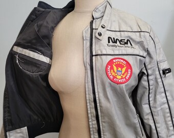 80年代ヴィンテージNASAジャケット：シルバーCIAブランド、ユースL