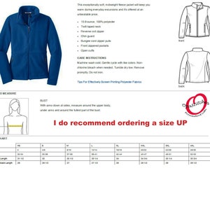 May include: A blue fleece jacket with a full zipper, front pockets, and a twill-taped neck. The image includes a size chart and care instructions. The jacket is made of 100% polyester and is designed for warmth.