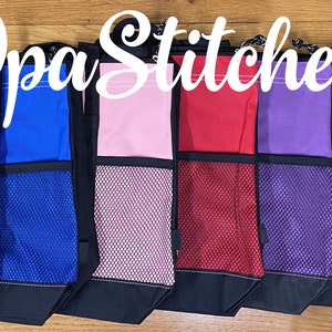 May include: A row of eight tote bags with different colored fabric panels and mesh pockets. The bags are all black with a drawstring closure. The text " Opa Stitches" is written in white cursive across the top of the image.