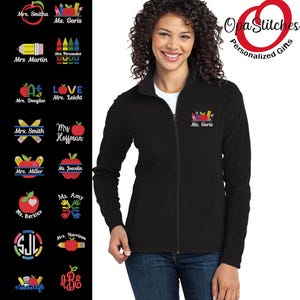 May include: A black fleece jacket with a full zipper, featuring an embroidered design of pencils, an apple, and the name "Ms. Goris" on the chest. The image also displays various teacher-themed designs and the text "Opa Stitches Personalized Gifts."