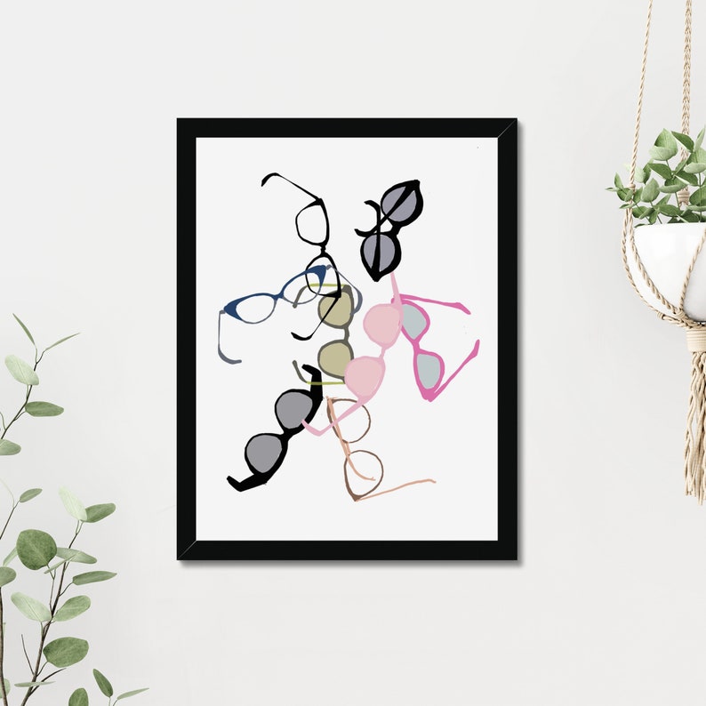 May include: A framed print of a colorful abstract design featuring various styles of glasses and sunglasses. The glasses are arranged in a random pattern, creating a playful and modern aesthetic.