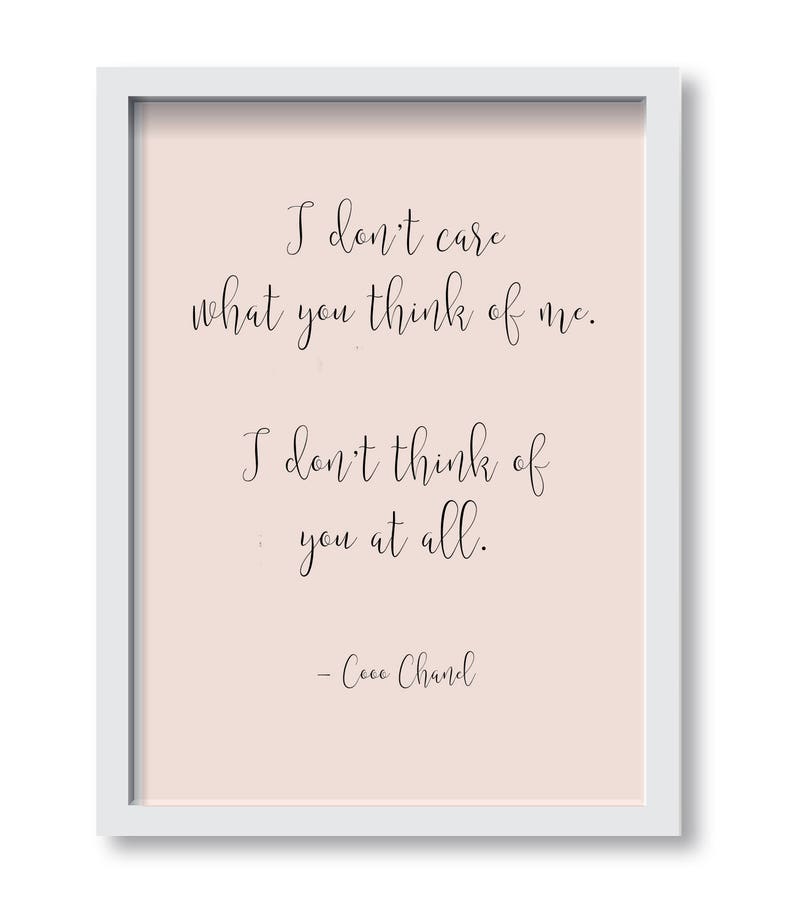 May include: A pink background with a white frame and a black quote that reads "I don't care what you think of me. I don't think of you at all. - Coco Chanel"