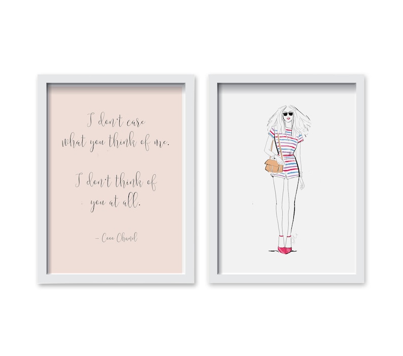 May include: Two framed prints, one with a quote by Coco Chanel that reads "I don't care what you think of me. I don't think of you at all." and the other with a line drawing of a woman wearing a striped jumpsuit and sunglasses.