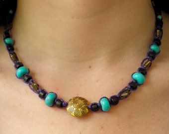 Purple necklace in macrame hemp with brass, turquoise and wood beads