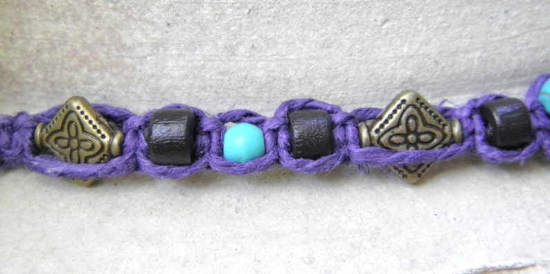 Hemp necklace in purple with brass turquoise and wood beads