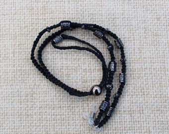 Black eyeglass holder with black hemp macrame, etched silver beads