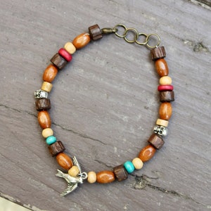 Jack Sparrow  bracelet/anklet inspired by the pirate with wood beads, silver sparrow charm, skull beads  in your length