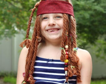 Yarn dreads for a child's Jack Sparrow costume with beads, charms, ties