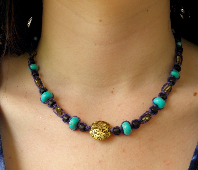 Hemp necklace in purple with brass turquoise and wood beads