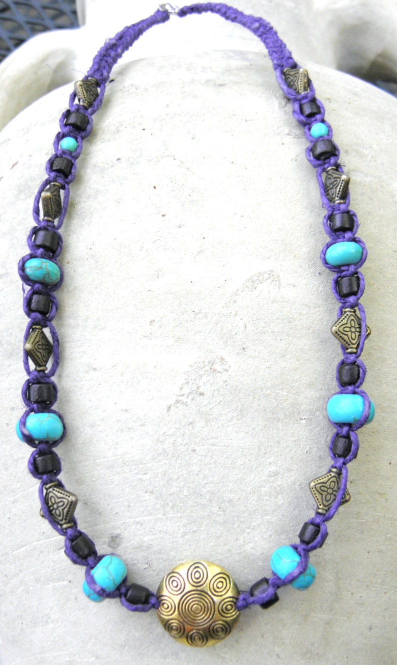 Hemp necklace in purple with brass turquoise and wood beads
