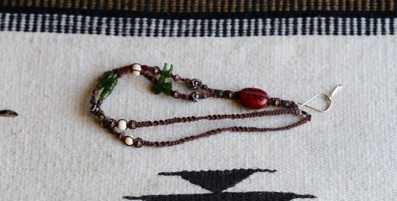bone Macrame Lanyard in dark brown hemp with polished wood bronze and animal-shaped beads jade