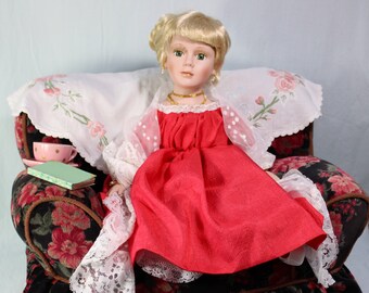 Porcelain Doll sitting on Sofa in Red Gown with teacup and book OOAK 28cm tall