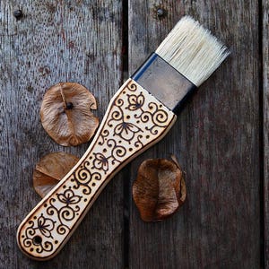 Wood-burned pastry brush with flowers and vines