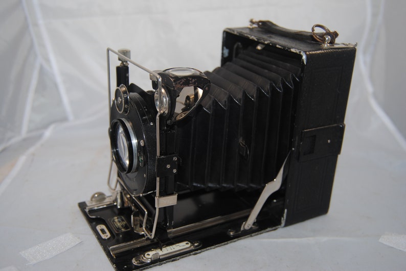 Vintage COMPUR bellows camera w 4 backing film plates.