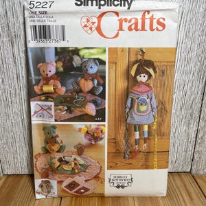 May include: A set of three ceramic mugs with a speckled, matte finish. The mugs are in shades of cream, light gray, and dark gray. Each mug has a simple, minimalist design and a rounded handle.