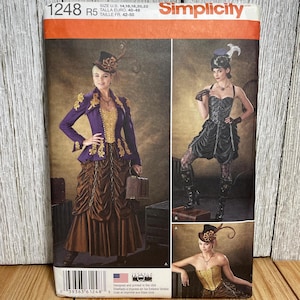 May include: Simplicity sewing pattern featuring steampunk-inspired designs. The pattern includes images of a woman in a purple jacket, brown skirt, and corset. The pattern number is 1248, and the size range is U.S. 14-22.