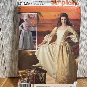 May include: Simplicity sewing pattern for historical costumes. The package features illustrations of women in period gowns. The size is U.S. 6-12, with Euro sizes 32-38 and French sizes 34-40. The package is printed in the USA.