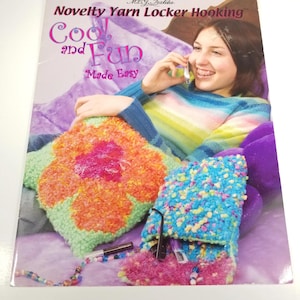 May include: A book cover titled "Novelty Yarn Locker Hooking" with the words "Cool and Fun Made Easy." The cover features a woman smiling while on the phone, and colorful yarn projects, including a flower-shaped pillow and a blue and pink project.