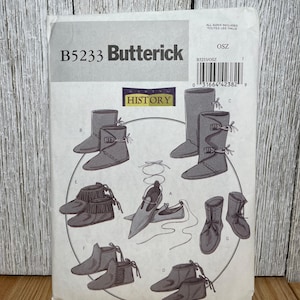 May include: A Butterick sewing pattern, B5233, featuring illustrations of various historical shoe styles. The pattern includes boots, ankle boots, and sandals. The package has the word "HISTORY" on it.